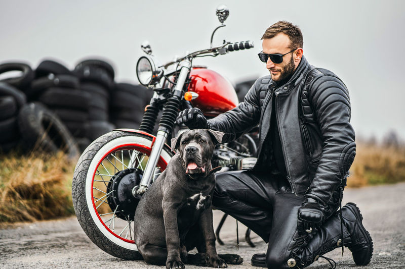Side view of a young man with dog