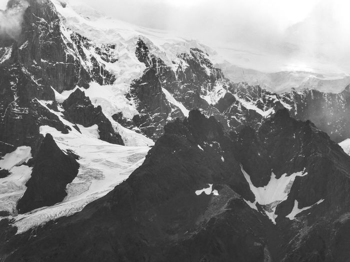 Black and white photo of snowcapped mountain