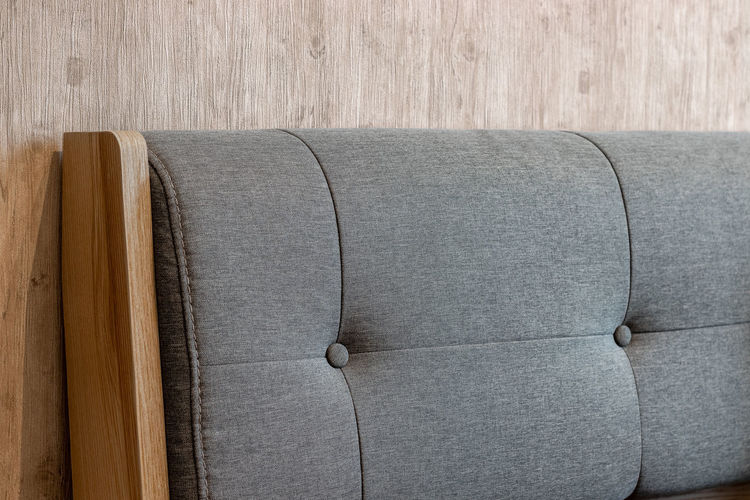 Close-up of sofa on table against wall