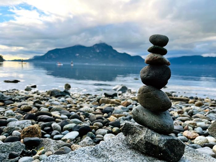 Rock balancing at beach with scenic view