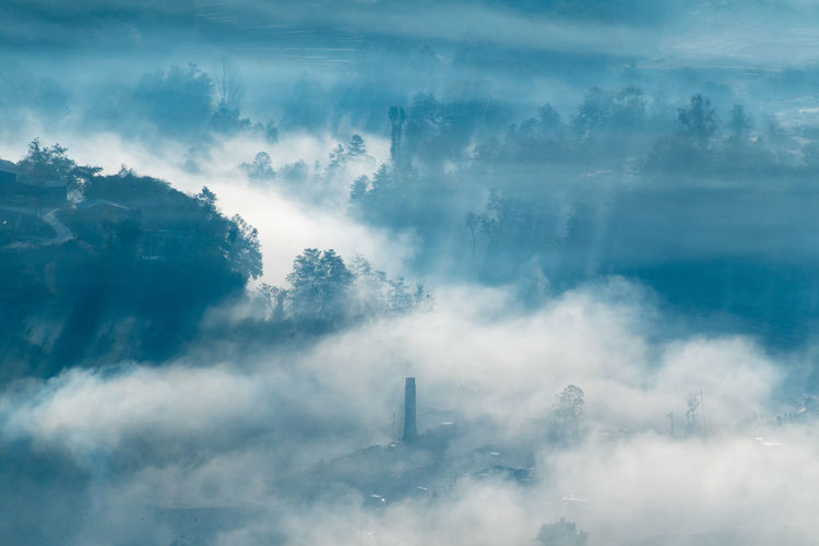 Smoke stacks against sky