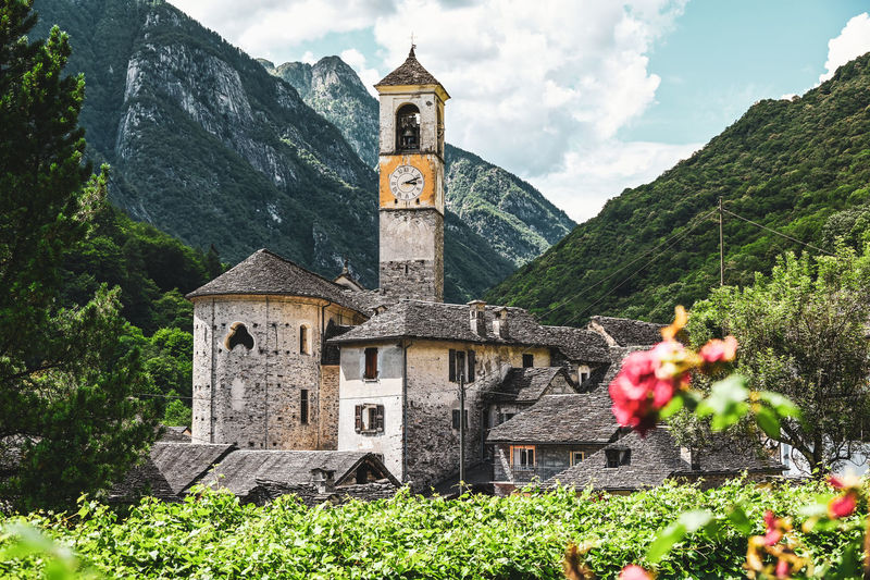 Scenic mountain village with church in swiss alps 