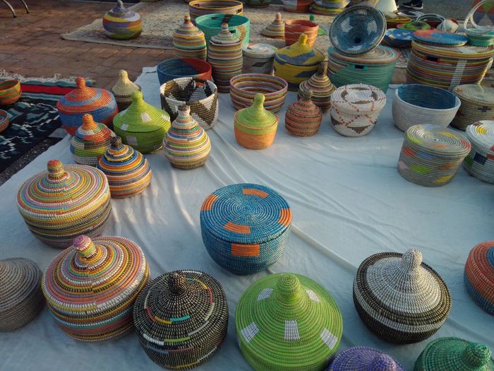 High angle view of multi colored containers for sale at market