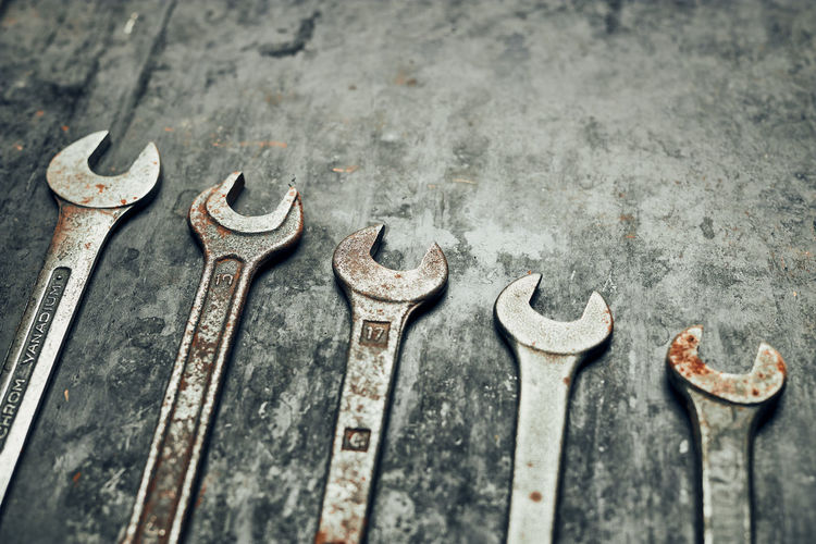 Spanners on steel surface. old rusty wrenches for maintenance. mechanic hardware tools to fix. tech