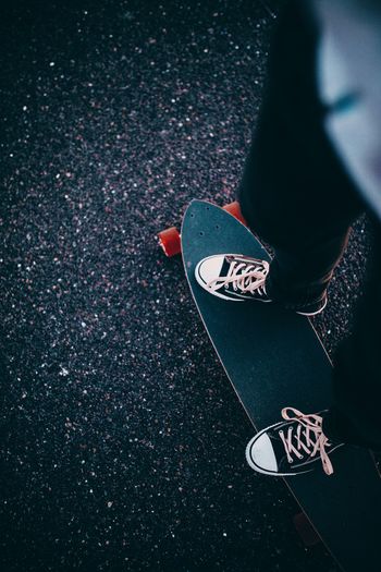 Low section of person on skateboard
