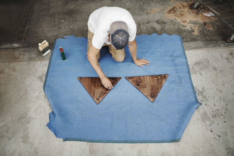High angle view of man working on floor
