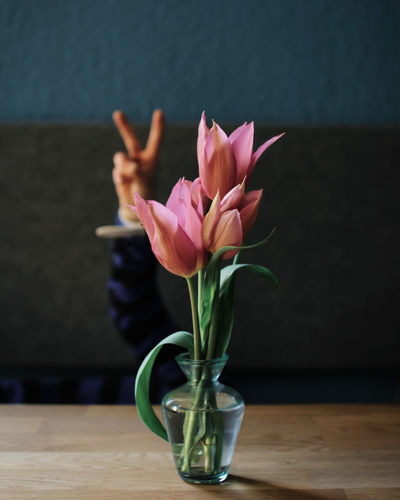 Close-up of pink flower vase on table
