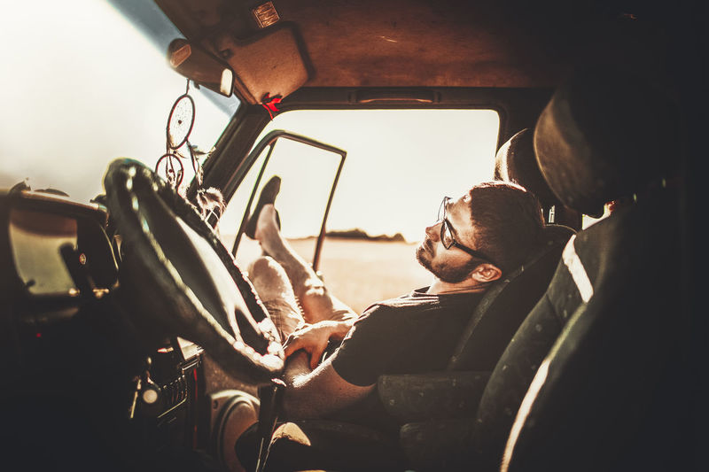 Man sitting in car