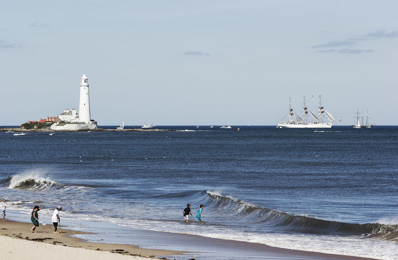 Scenic view of st mary lighthouse in sea against sky