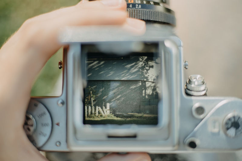Close-up of person using camera