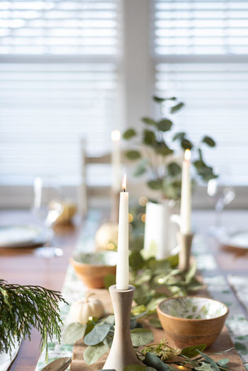 Close-up of candles on table