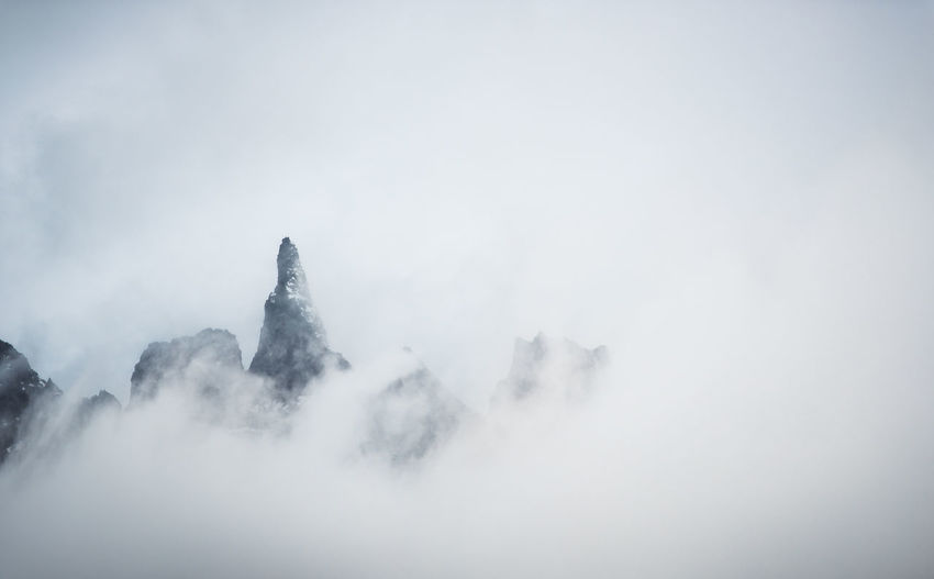 A peak is visible through very cloudy conditions in iceland
