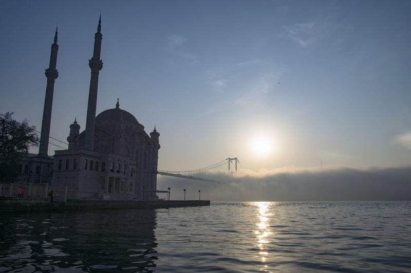 Ortakoy mosque and 15 july martyrs in foggy morning istanbul turkey 