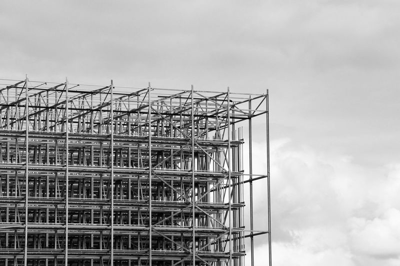 Low angle view of construction building against sky