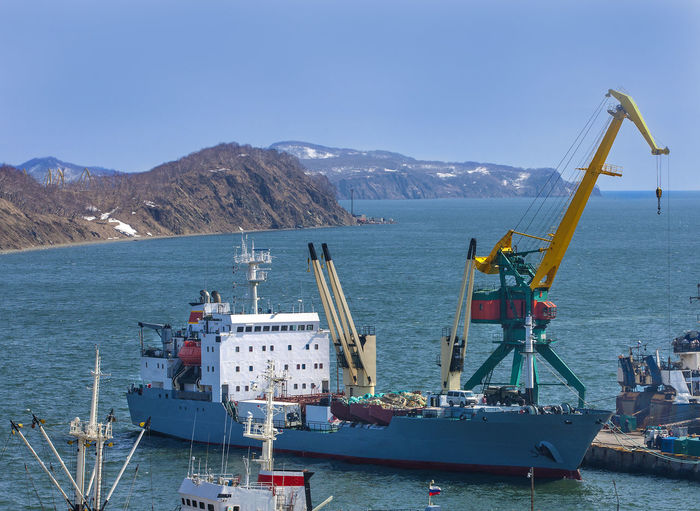 Container vessel unloaded in port on kamchatka peninsula