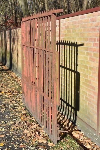 Metal gate against brick wall