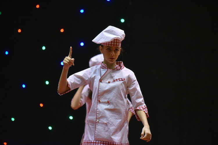 Young teenage girl in chefs cook's uniform