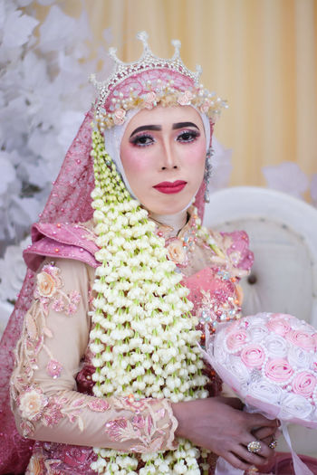 Portrait of bride wearing flowers