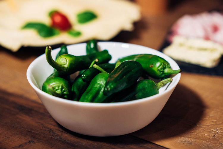 Close-up of jalapeno peppers in bowl on table