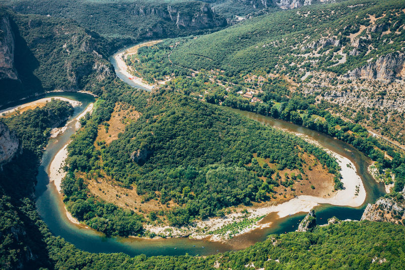 Aerial view of river flowing on landscape