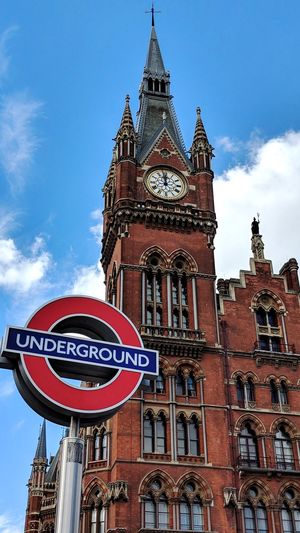 Kings cross underground low angle view of building against cloudy sky