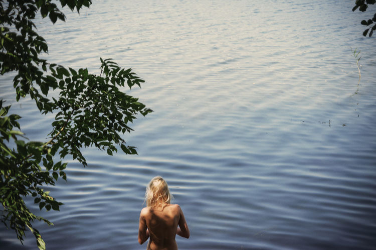 Side view of woman in water