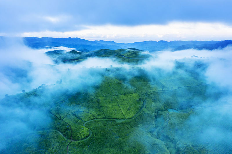 Aerial view of landscape against sky during foggy weather