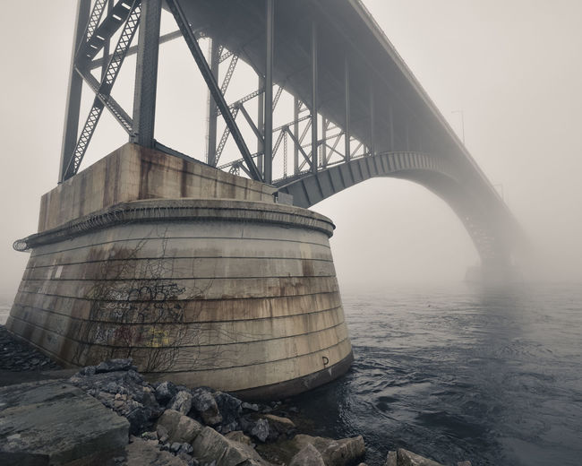 Peace bridge over lake erie in foggy weather