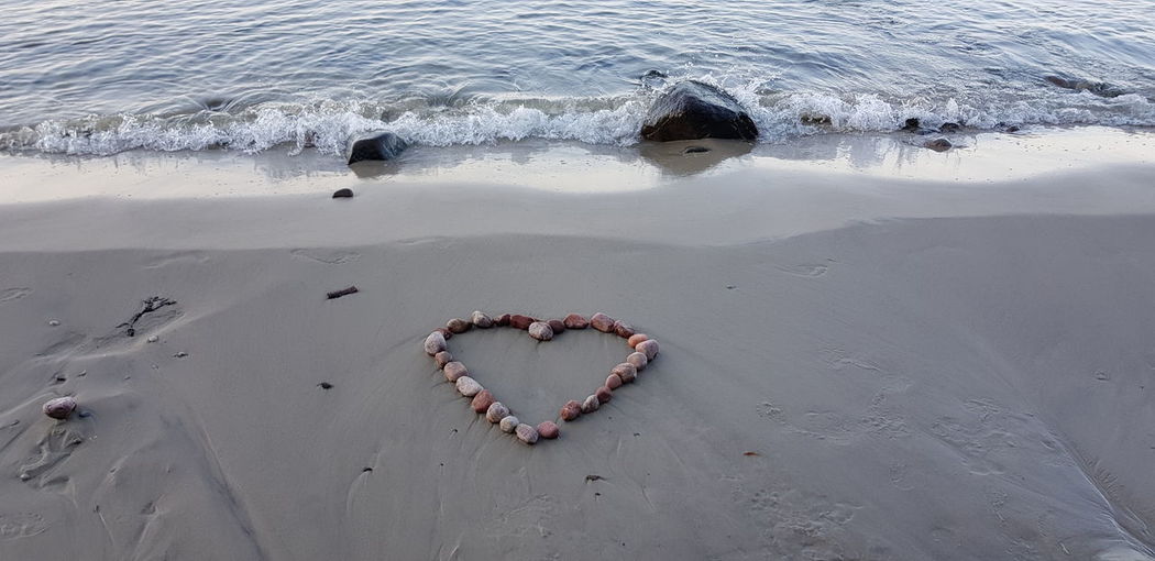 High angle view of heart shape on beach