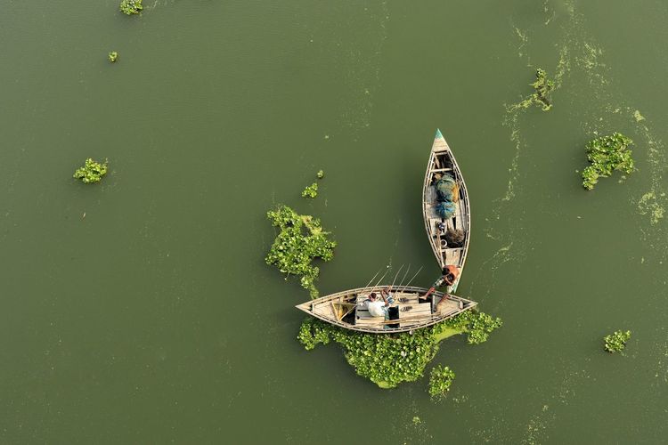 High angle view of boat floating on river