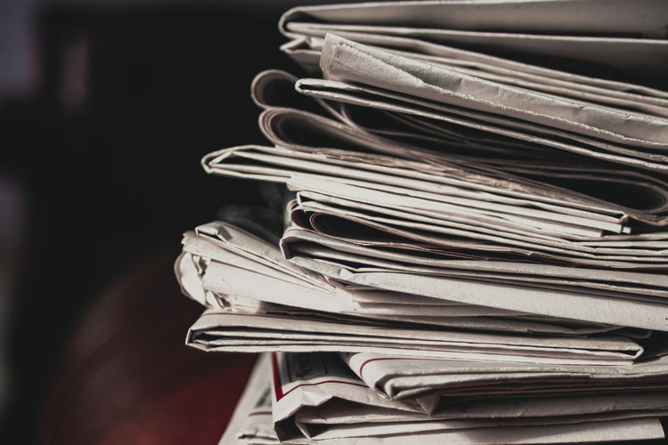 Close-up of stack of papers on table