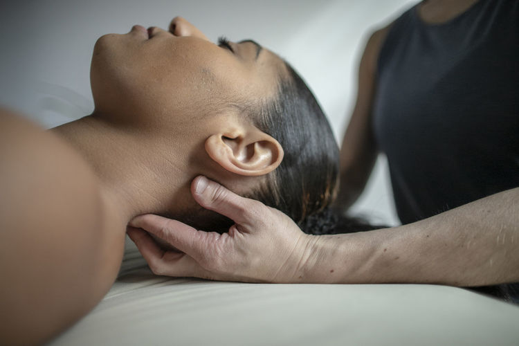Close up of african american female receiving neck massage