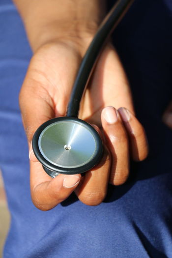 Close-up of hand holding a stethoscope 