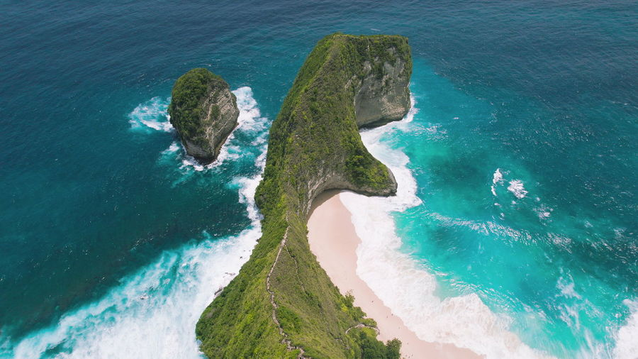 Nusa penida island bali best tourist attraction is kelingking beach. turquoise ocean coast.
