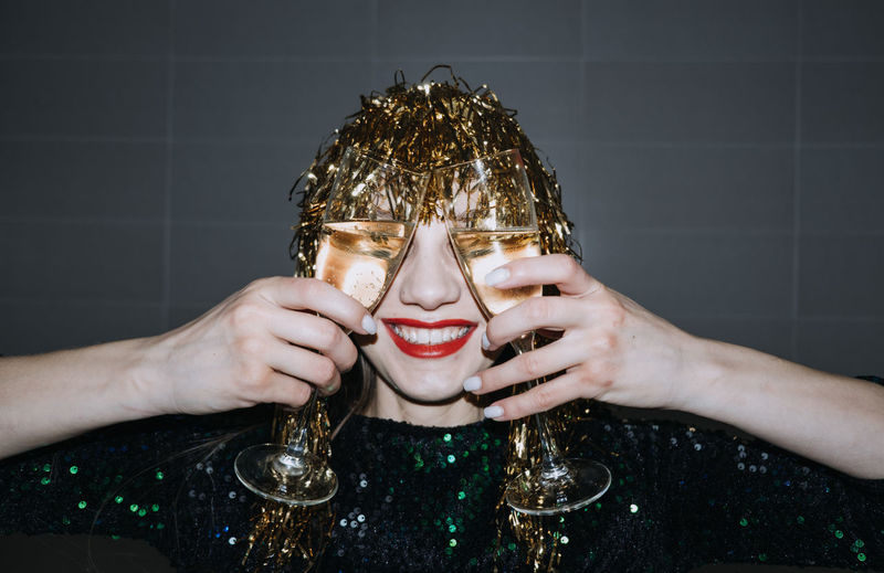 Happy new year. new year eve party celebration. beautiful woman with holiday makeup and gold shiny