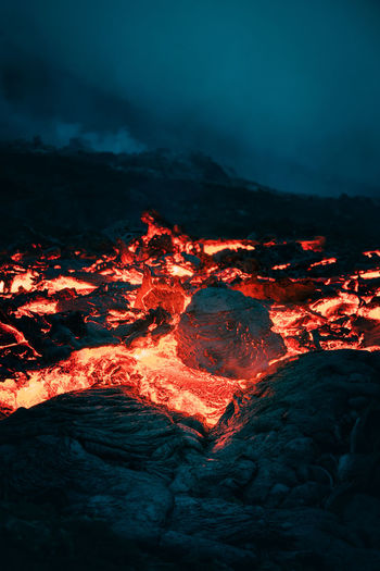 Atmospheric view of flowing lava at volcano eruption site in geldingadalir, iceland, june 2021