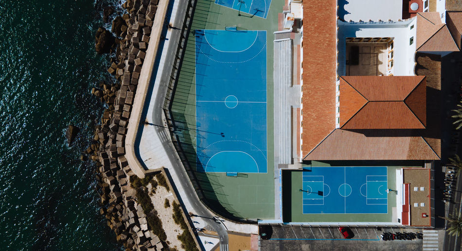 High angle view of swimming pool by building