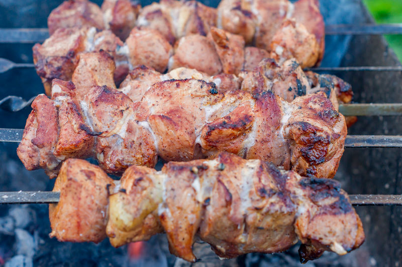 Closeup of grilled meat on bbq outdoors