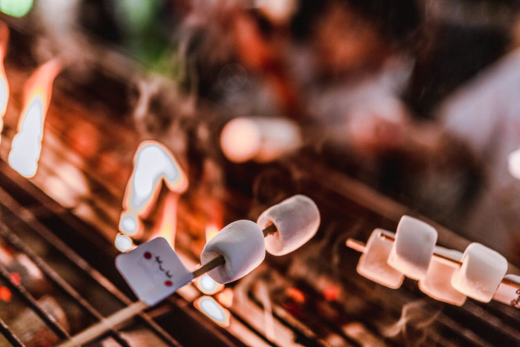 Close-up of marshmallows roasting on barbecue