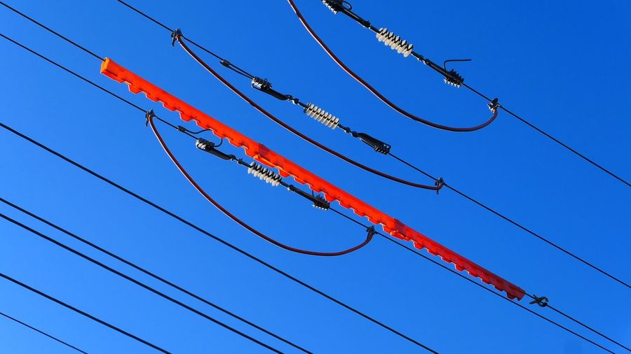  view of electricity cables against clear blue sky