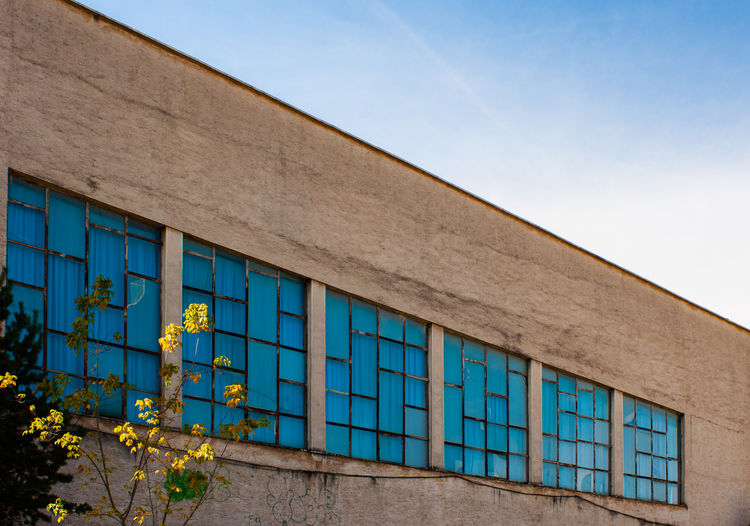 Low angle view of building against blue sky