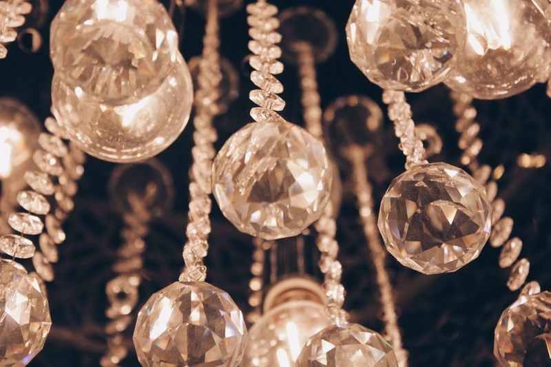 Full frame shot of illuminated chandelier hanging at night