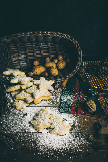 High angle view of cookies and walnuts on table