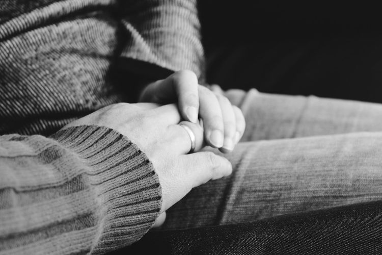 Close-up of couple holding hands