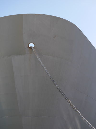 Low angle view of rope in ship hole