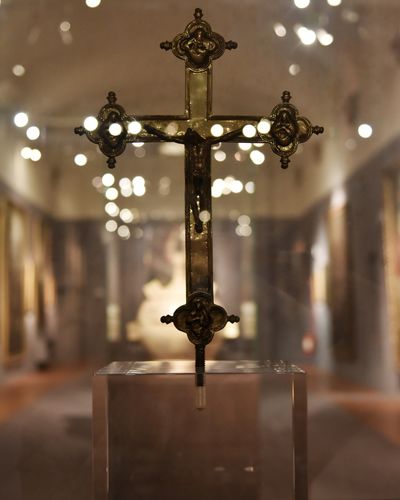 Close-up of illuminated cross in building