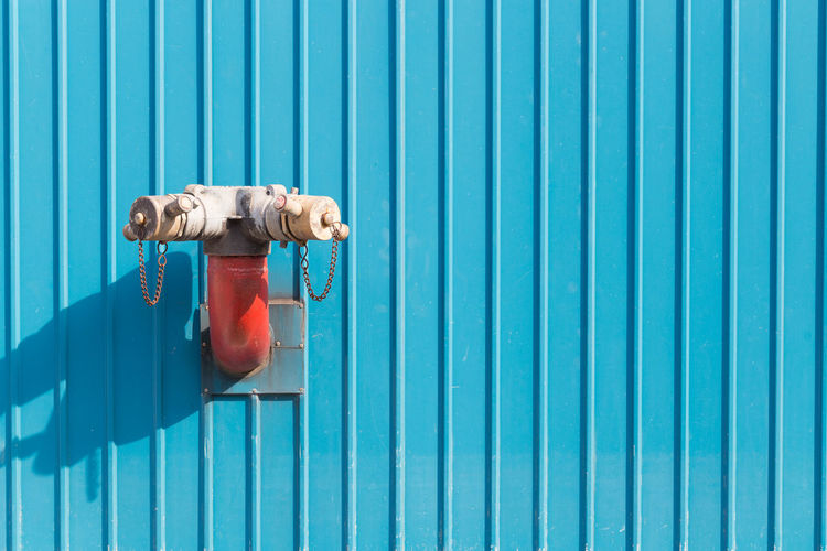 Fire hydrant on corrugated iron