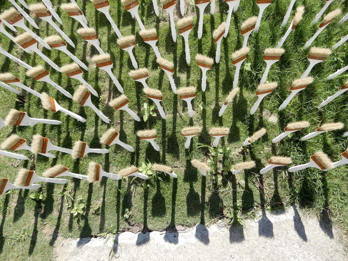 High angle view of paintbrushes on field