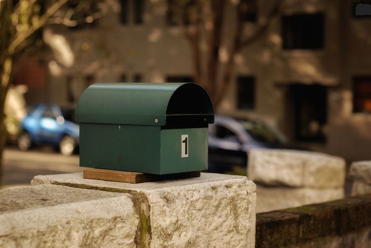 Close-up of a mailbox on a wall