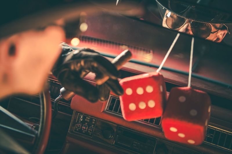 Man smoking cigar while sitting in car